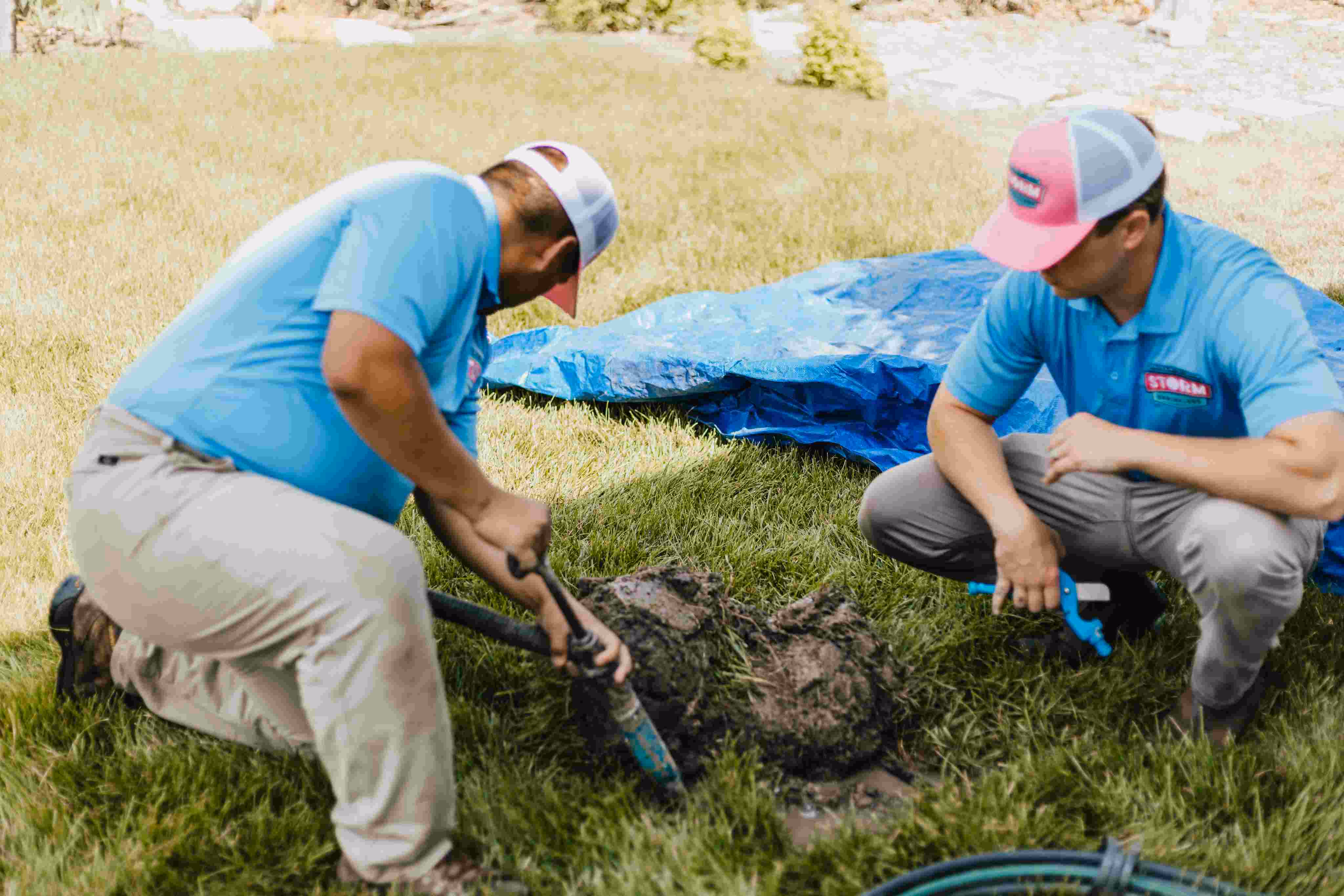Storm Sprinklers technician repairing sprinkler system leak for Utah County and Salt Lake County homeowner