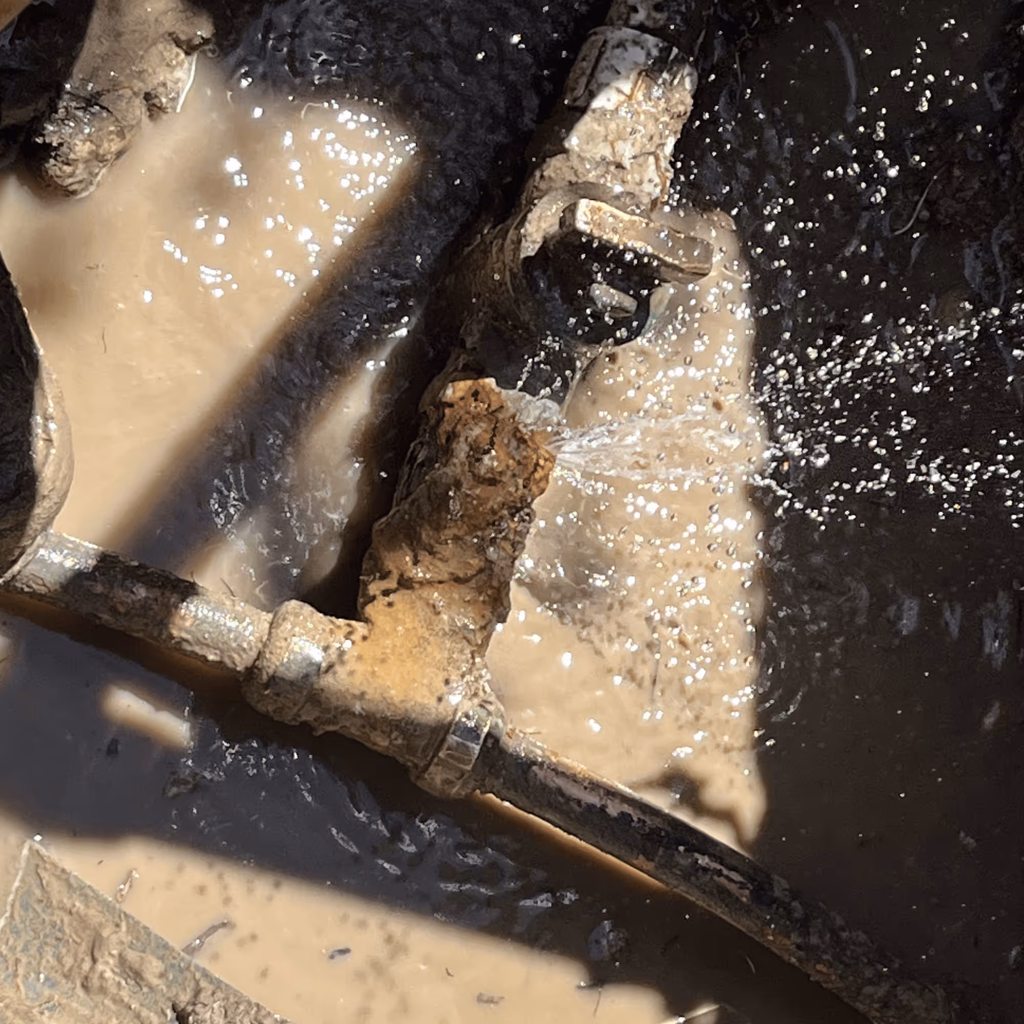 Severely corroded brass stop and waste valve on a Utah culinary line before repair or replacement